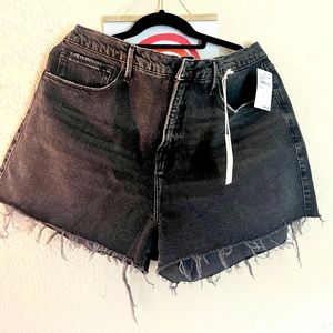 Good American black jean shorts. Distressed look. NWT.